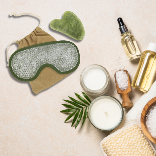 Sun & Sia gel eye mask with jade gua sha stone in spa setting with candles, face cream, bath salts, and essential oils.